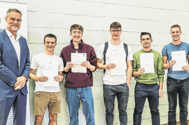 Principal Brett Freeman with students on A-level results day