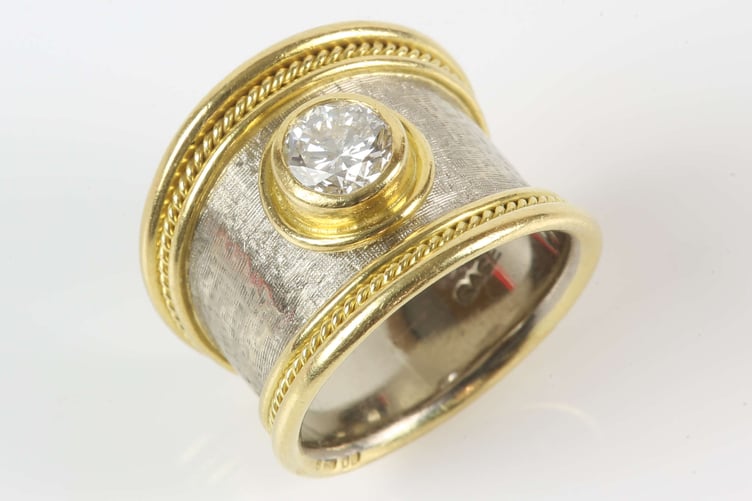 An Elizabeth Gage gold and diamond tapered Templar ring is being auctioned by Ewbank's