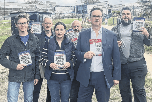 Woking MP Jonathan Lord, second right, and a group of campaigners get their message across outside Pool in the Park