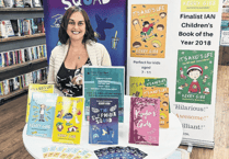 Kerry goes by the book to help Woking hospice