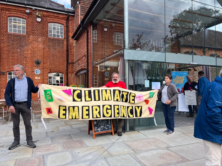 Extinction Rebellion protesters outside the Farnham Maltings ahead of Farnborough Airport's consultation drop-in