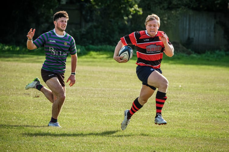 Chris Swan runs in a try for Woking against Mitcham & Carshalton