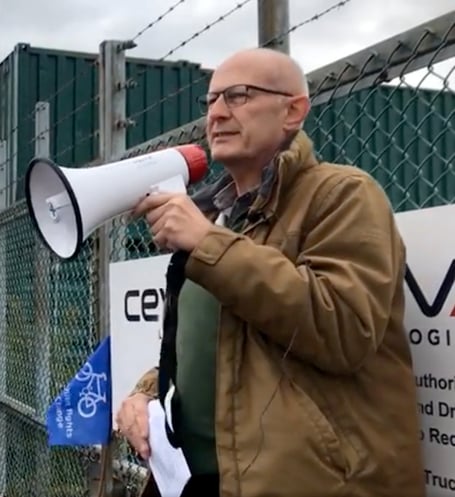 Colin Shearn addressing a 2021 protest at Farnborough Airport