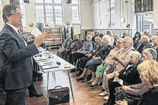 Jonathan Lord addressing the Woking Community Transport annual meeting