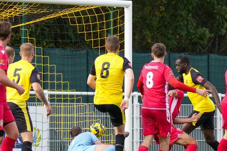Quincy Rowe, right, gives Westfield the lead against Hungerford Town