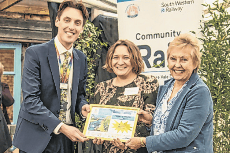 Rebecca Bradshaw, centre, and Diane Cozens receive the gold award from SWR’s Stuart Meek