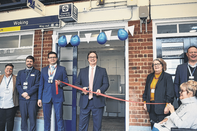 Woking MP Jonathan Lord cutting the ribbon to officially open Woking Station’s new Changing Places facility in May