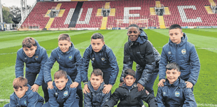 Kids from Woking's twin town in France visit for football tournament