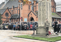 Woking town centre falls silent for Remembrance service
