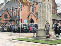Woking town centre falls silent for Remembrance service
