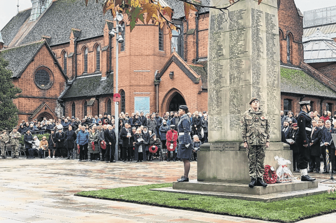 Respectful crowds gather alongside local dignitaries for the Service of Remembrance and wreath-laying ceremony in Jubilee Square in Woking town centre last Sunday (November 12)