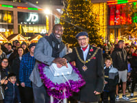 Hasselbaink makes star turn at Woking Christmas tree lights switch on