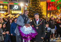 Hasselbaink makes star turn at Woking Christmas tree lights switch on