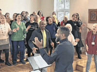 Mark De-Lisser, vocal coach to stars, runs singing workshop in Woking