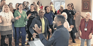 Mark De-Lisser, vocal coach to stars, runs singing workshop in Woking