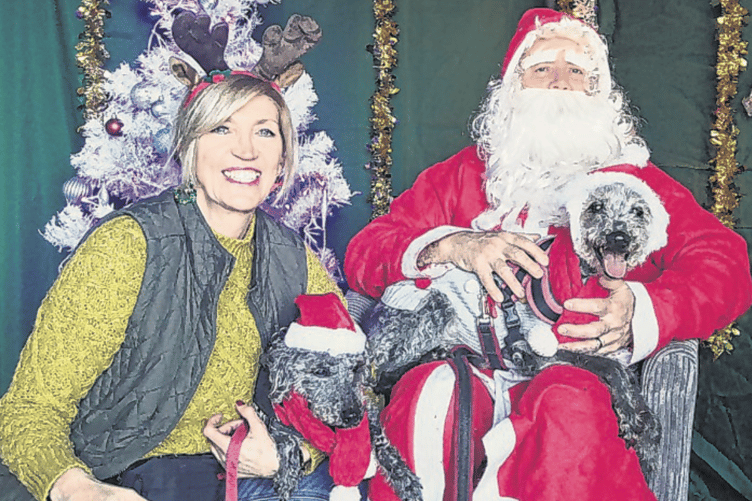 Santa Paws organiser Sarah Mullins with her dogs Boo and Betsy in Santa’s grotto at New Life Church