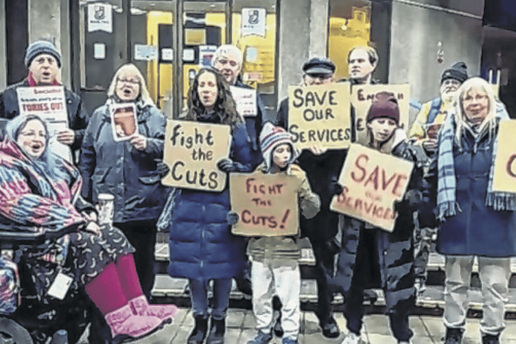 Protesters gathered outside the borough council offices