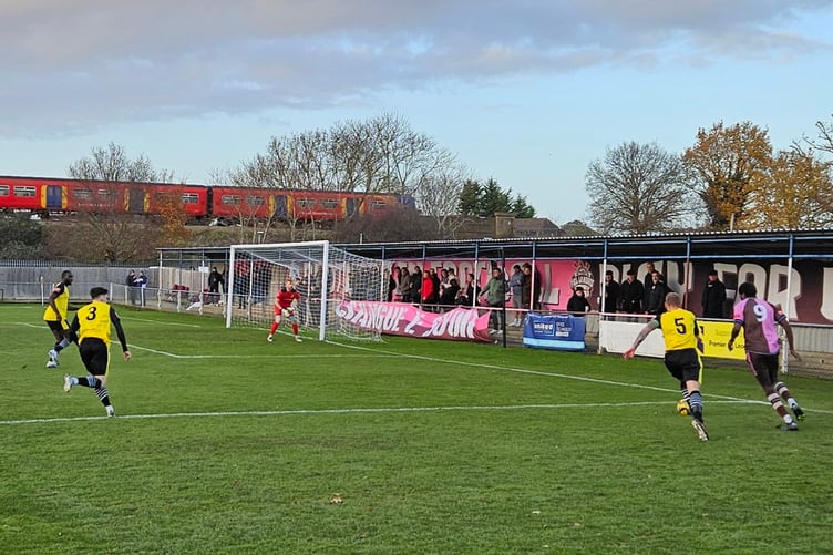 Westfield, yellow and black, on their way to a 1-1 draw at Corinthian-Casuals last Saturday (December 9) in the Pitching In Isthmian League