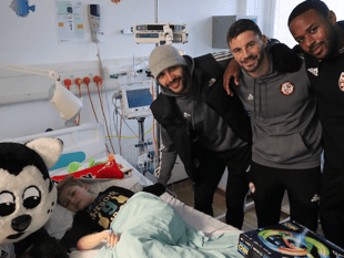 Footballers raise sick kids' spirits with annual visit to hospitals