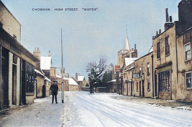 A picture postcard from the 1900s showing a snowy Chobham High Street. However, the photograph is a fake of sorts