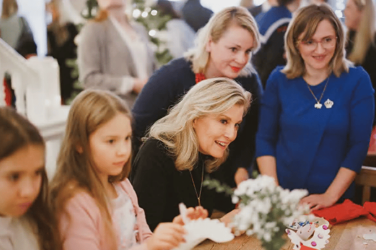 The Duchess of Edinburgh joins a craft session at the party