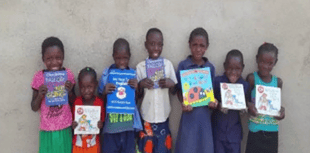 Woking District Rotarians give £2,000 to Africa literacy charity
