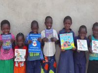Woking District Rotarians give £2,000 to Africa literacy charity