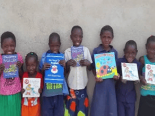 Woking District Rotarians give £2,000 to Africa literacy charity