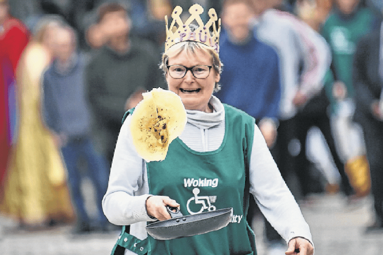 A competitor in action during a previous edition of the pancake race in Jubilee Square