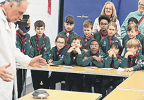 Woking District Cubs get to grips with experiments on annual science day