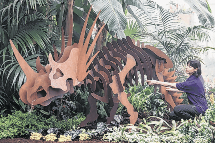 Hannah Blackmore admires the sculptures that make up part of the RHS Wisley Houseplant Takeover – Plants Before Time display