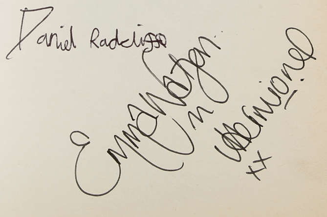 Two of the autographs on the first-edition paperback of novel Harry Potter and the Prisoner of Azkaban. The book is signed by six stars of the movie version of the story