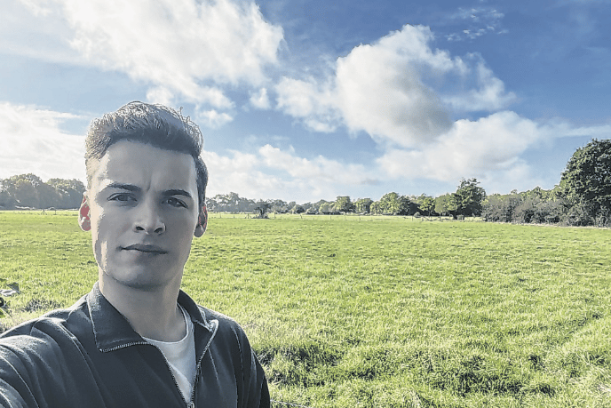 Cllr Josh Brown at the site of the proposed development of up to 555 homes and 15 Traveller pitches in West Byfleet. Residents are being urged to make their voices heard over the far-reaching proposals