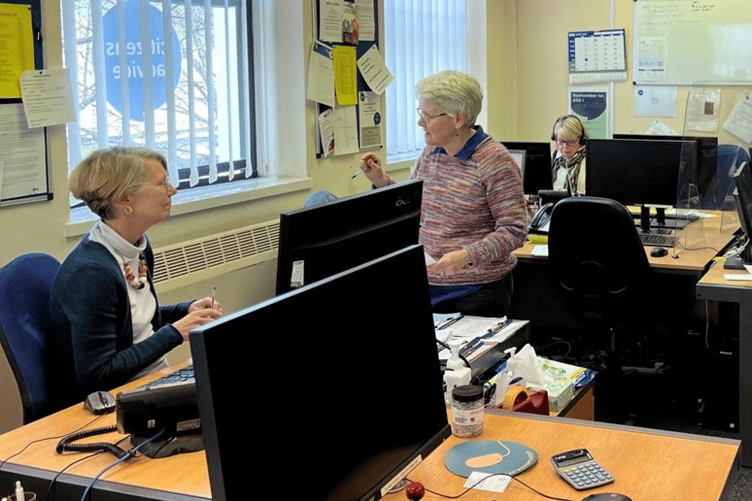 Volunteers and staff at work in the offices of Citizens Advice Woking. But for how much longer as cuts bite?