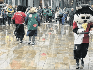 Woking Security batters competition and rain in annual pancake race