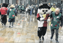 Woking Security batters competition and rain in annual pancake race