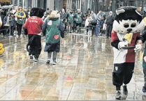 Woking Security batters competition and rain in annual pancake race