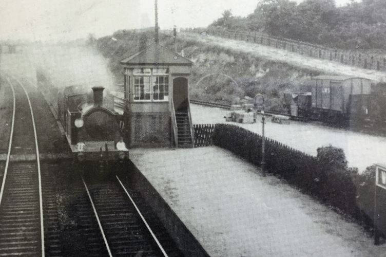 An N class locomotive at Worplesdon station in the 1960s when the platforms were being extended