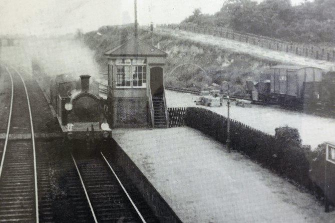 An N class locomotive at Worplesdon station in the 1960s when the platforms were being extended