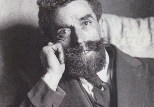 Jean Pierre Vaquier, note his thick curly hair, square cut-back beard and flamboyant moustache