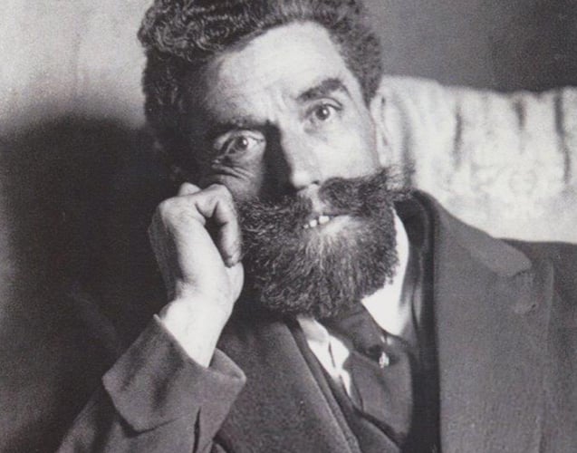 Jean Pierre Vaquier, note his thick curly hair, square cut-back beard and flamboyant moustache