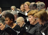 Celebrated composer prepares Woking choir for concert