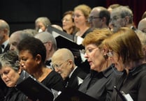 Celebrated composer prepares Woking choir for concert