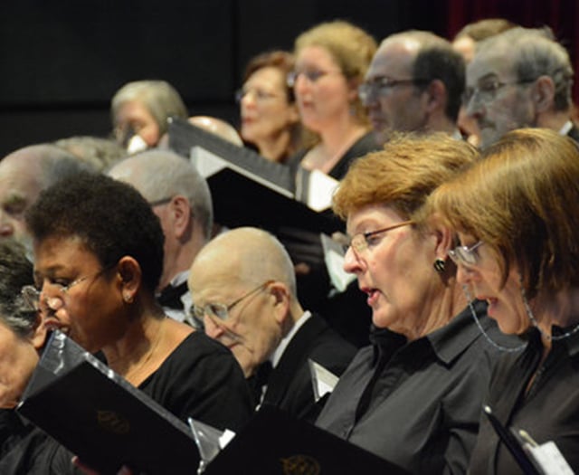 Celebrated composer prepares Woking choir for concert