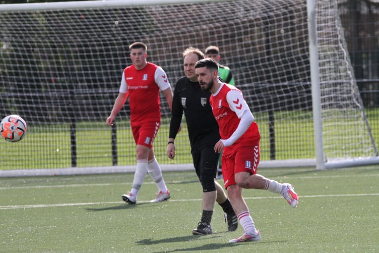 Action from Sheerwater Pilgrims' 7-1 win against University of Surrey (Photo: Daniel Eicke)