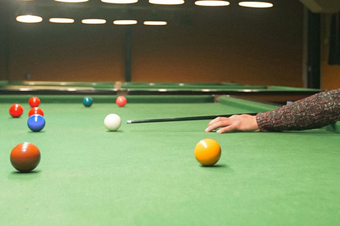 Woking's Parkinson’s community is being given the cue to start playing snooker (Photo: Aakash Sunuwar/Unsplash)