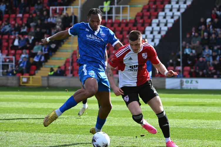 Action from Woking's 1-0 defeat against Eastleigh on Good Friday (Photo: Andy Fitzsimons)