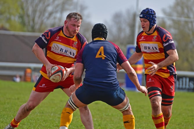 Chobham's Pete McCain eyeing up an opponent with Justin Rowland at his right shoulder (Photo: John O'Brien)