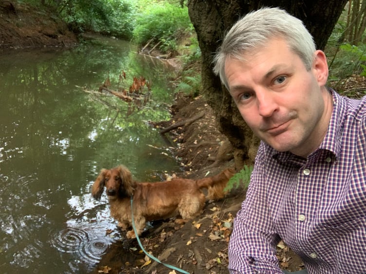 Will Forster and his dog Toffee by the Hoe Stream
