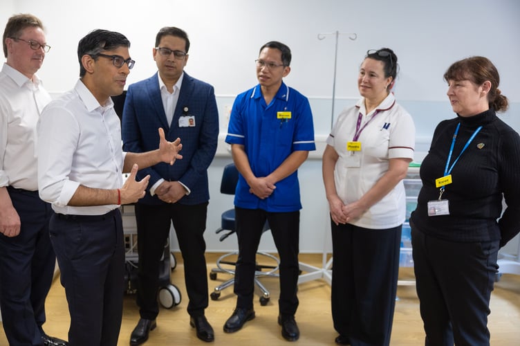 11/04/2024. Woking, United Kingdom. The Prime Minister Rishi Sunak visits Woking Community Hospital where he met staff and spoke with a patient having a bone diagnostic test in the Community Diagnostic Centre. Picture by Simon Walker / No 10 Downing Street